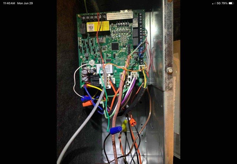 Responded to service call for intermittent unit shutdown due to moisture sensor alerts in drain pan on recently installed system. Accessed crawlspace air handler with ladder and inspected condensate drain system and safety float switch. Verified control board connections and sensor wiring at air handler control panel. Brought replacement backup sensor as requested and completed system diagnostic to resolve false moisture detection causing premature shutdowns.