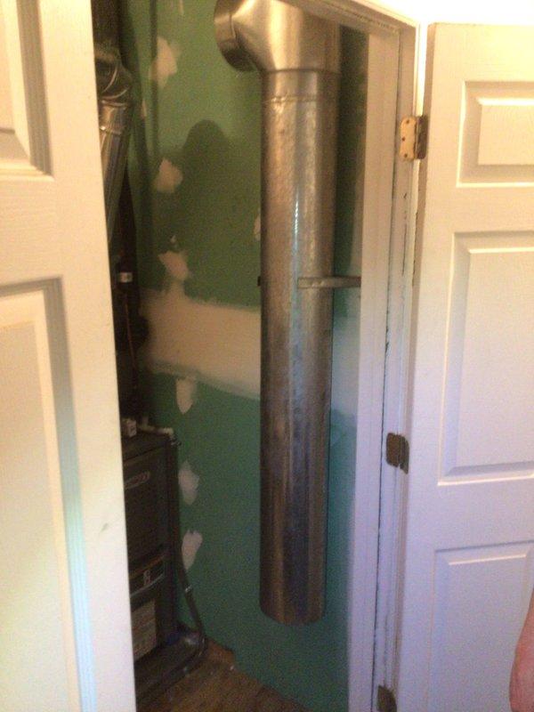 Responded to no cooling call on one-year-old Goodman air conditioning system affecting entire residence. Upon arrival, performed diagnostic evaluation of indoor and outdoor equipment. Inspected evaporator coil, condensate drain system, and ductwork installation in mechanical closet. Verified proper airflow through supply and return plenums. System components showed normal wear for age with minor dust accumulation on metal ductwork surfaces. Completed visual inspection of electrical connections, refrigerant lines, and mechanical space accessibility. Documented equipment condition with photographs for service records.