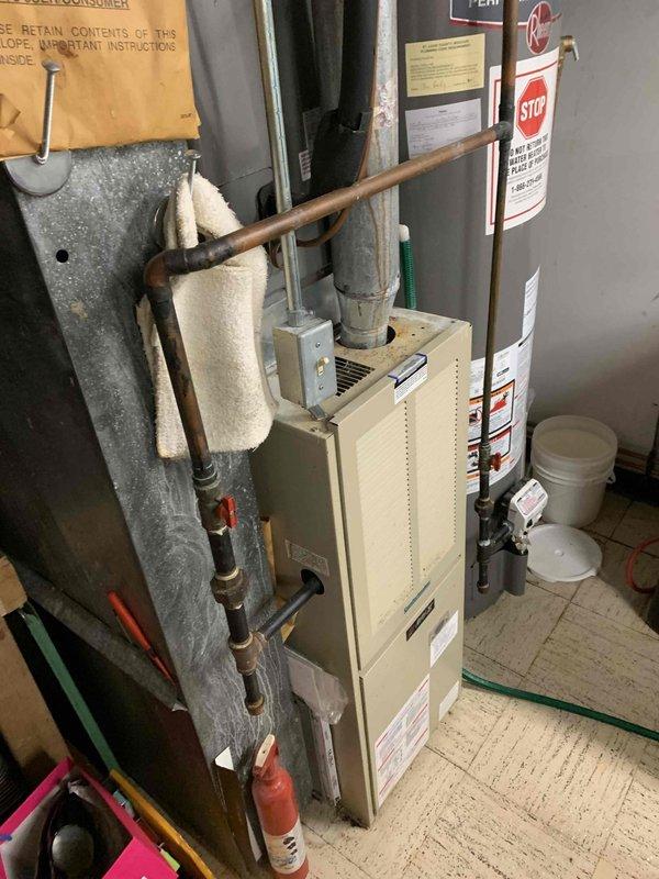 Responded to no cooling complaint on 5-year-old residential air conditioning system. Upon arrival, performed diagnostic evaluation of outdoor condensing unit and indoor air handler components. Inspected electrical connections, refrigerant lines, and ductwork system throughout basement mechanical room. Verified proper operation of furnace and associated HVAC equipment. System restored to normal cooling operation with all components functioning within manufacturer specifications.