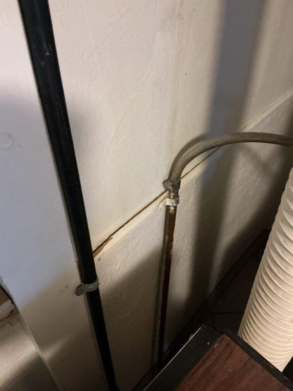 Responded to water leak complaint from indoor air handler unit. Upon arrival, found condensate drain line clogged, causing water to back up and overflow into collection bucket when system operates. Cleared obstruction from drain line, verified proper drainage flow, tested system operation, and confirmed no further leakage occurring.