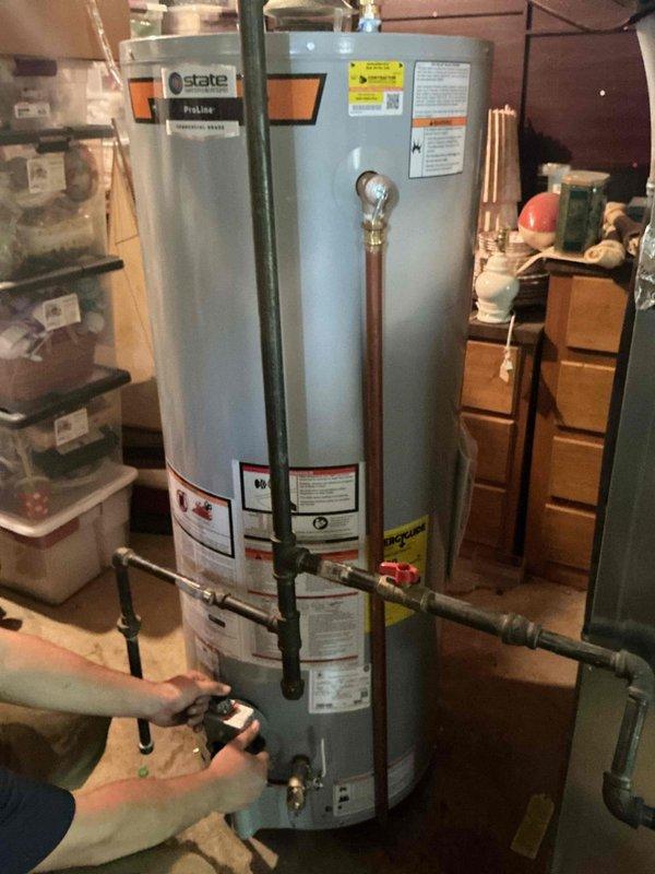 Installed a new 50-gallon tall gas water heater in basement utility area, replacing existing unit. Completed all necessary copper piping connections, pressure relief valve installation, and gas line hookup per manufacturer specifications and local code requirements. Secured permit through City of Ballwin (Permit #26-002930) for the installation. Properly positioned unit for adequate clearance and access, connected water supply lines with appropriate shutoff valves, and verified all connections for leaks. Tested unit operation, confirmed proper venting, and ensured all safety features were functioning correctly upon completion.