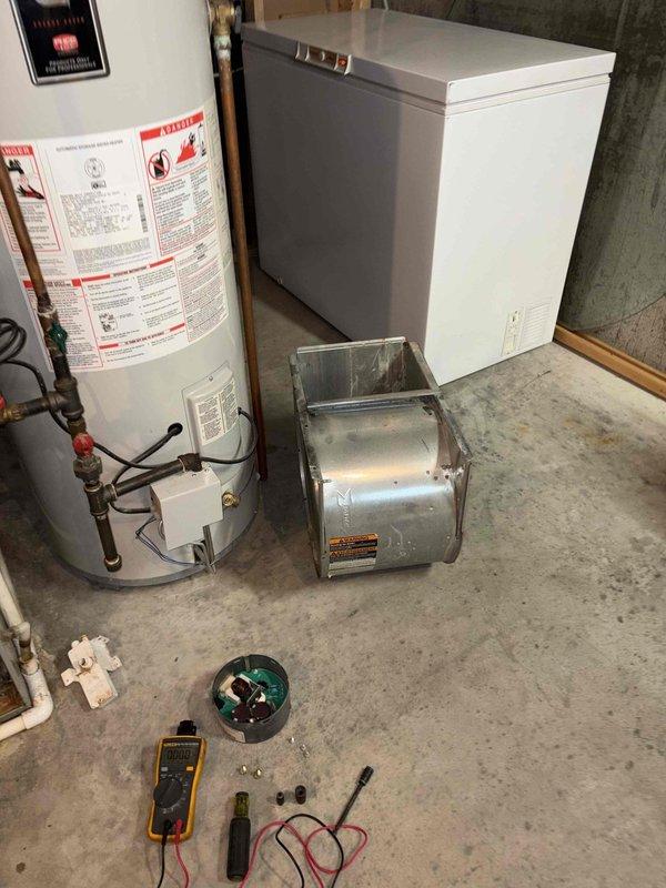 # HVAC Service - No Cool 10+

Responded to no cooling call where outdoor unit was running but indoor blower failed to engage. Upon arrival, performed diagnostic testing on the blower motor assembly located in the basement air handler system. Using multimeter, confirmed blower motor had failed electrically and was preventing air circulation through the system. Removed and disassembled blower assembly housing to access the motor. Replaced defective blower motor with new unit, reassembled blower housing, and reinstalled into air handler. Verified proper electrical connections, tested motor operation across all speed taps, and confirmed adequate airflow through the system. Cycled system through complete cooling operation to ensure outdoor unit and indoor blower now functioning in proper sequence. System restored to normal cooling operation with no further issues detected.