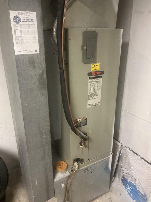 Responded to no cooling complaint on single air conditioning unit located at ground level behind residence. Upon arrival, found system had experienced evaporator coil freeze-up requiring manual defrost before service could be performed. Connected refrigerant gauges to condenser unit to diagnose cooling issue and verify system pressures after coil thawing was complete.