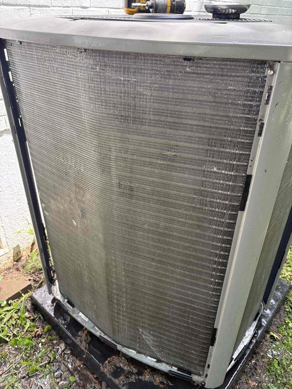 Responded to customer complaint of loud noise coming from outdoor AC unit. Upon inspection, found condenser coil heavily contaminated with dirt, dust, and debris buildup restricting airflow and causing system strain. Performed thorough coil cleaning to remove accumulated contaminants from fin surfaces, restoring proper airflow through the condenser. Unit tested and operating normally with noise issue resolved.