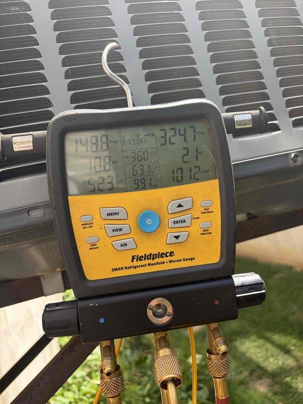 Responded to no cooling complaint on 11-year-old residential air conditioning system. Upon arrival, performed comprehensive diagnostic evaluation using refrigerant manifold gauges to measure system pressures and temperatures across suction and liquid lines. Electrical testing conducted with clamp meter revealed low amperage draw of 0.94 amps at outdoor unit, indicating compressor failure to operate under load. Inspected electrical panel components including capacitor and control wiring. System was non-operational due to compressor malfunction. Customer advised unit requires compressor replacement or full system replacement given age of equipment and advised to keep system off to prevent further damage.