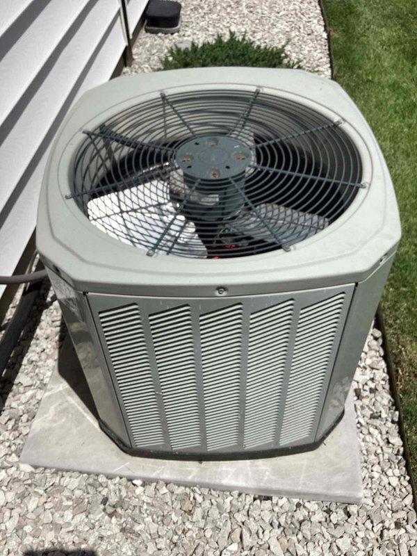 Responded to no cooling complaint on ground-level condenser unit. Upon inspection, identified failed dual-run capacitor preventing compressor operation. Replaced defective capacitor with new unit and restored system to normal operation. Advised to shut AC off temporarily and run fan only until repair was completed to prevent further strain on system components.