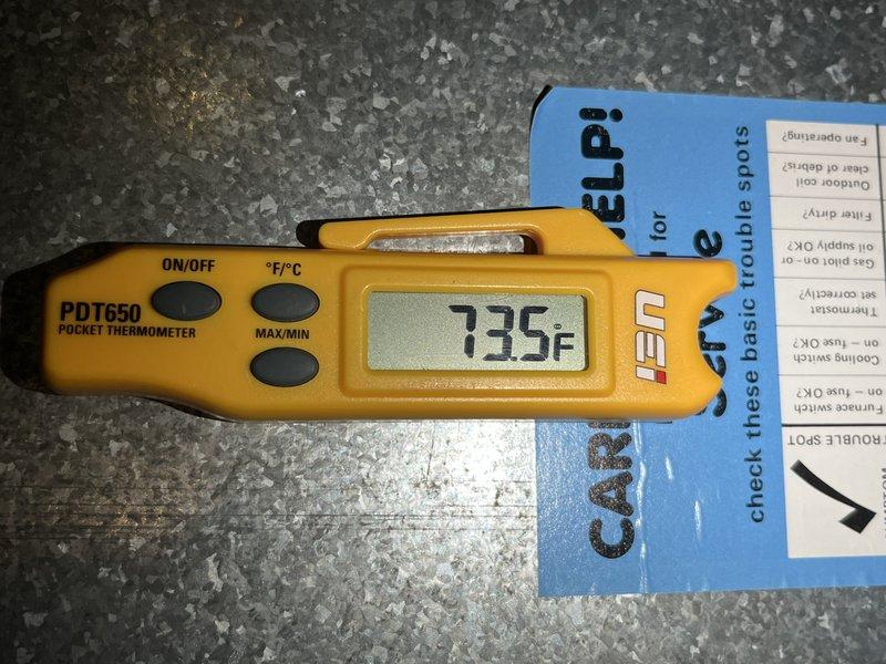 Responded to no cooling complaint on 10+ year old unit located at ground level. Performed diagnostic temperature measurements using digital thermometer, recording supply air temperature of 73.5°F and abnormally high discharge line temperature of 654°F, indicating potential compressor failure or refrigerant system issue. Advised customer to shut off AC system immediately to prevent further damage and keep fan running for air circulation until repairs can be completed.