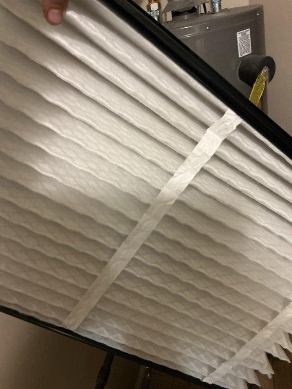 Completed comprehensive cooling system tune-up on 6-year-old outdoor AC unit. Inspected and documented air filter condition showing moderate dust accumulation in pleats, examined electrical control boards and wiring connections, and verified all system components for proper operation. Unit tested and confirmed operational within manufacturer specifications.