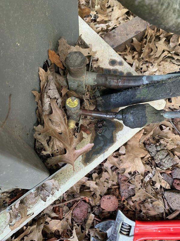 Responded to no cooling complaint on 14-year-old outdoor condensing unit reported to be blowing warm air. Upon arrival, performed diagnostic inspection and discovered severely clogged air filter with heavy dirt and debris accumulation restricting airflow. Inspected refrigerant lines for leaks or damage, noting weathered line insulation and minor surface corrosion on copper piping but no active refrigerant leaks detected. Replaced dirty filter with new unit, verified proper airflow restoration, and tested system operation. Unit returned to normal cooling function after filter replacement. Advised ongoing maintenance requirements for aging equipment.