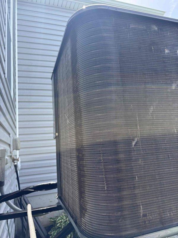 Responded to no cooling complaint on residential air conditioning system. Upon arrival, found outdoor condenser unit heavily soiled with dirt, dust, and debris accumulation significantly restricting airflow through coil surfaces. Performed thorough cleaning of condenser coil and exterior cabinet to restore proper airflow and heat transfer efficiency. System operational following service with adequate cooling capacity restored.