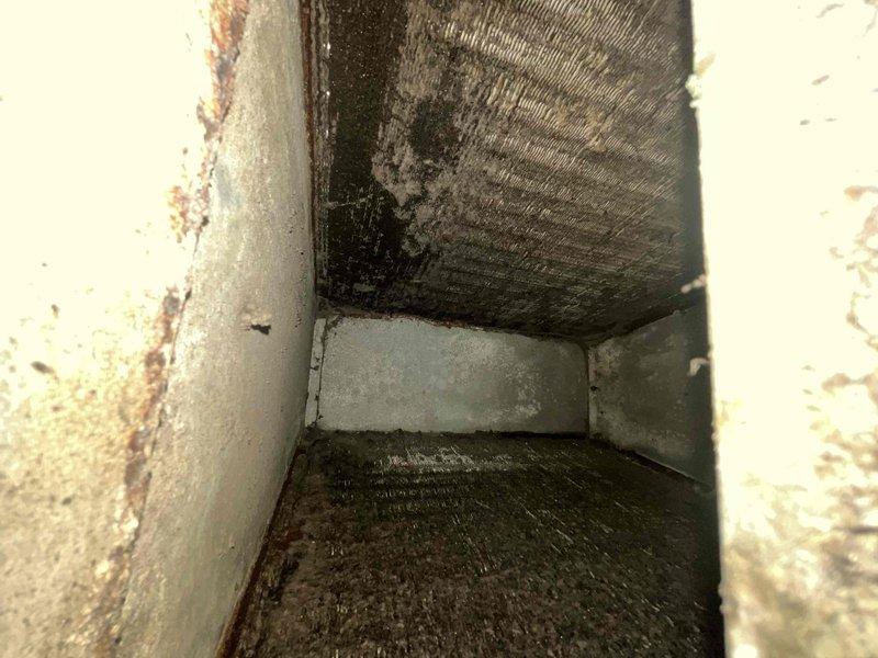 Responded to no cooling complaint on two residential HVAC units over 10 years old. Upon inspection, discovered extensive mold and mildew contamination throughout air handler compartments and ductwork, with significant moisture damage, rust staining, and biological growth on metal surfaces. Documented severe deterioration of interior components including corroded ductwork, peeling paint, and compromised insulation materials. Advised customer that the warm air issue is compounded by contaminated air distribution system requiring professional duct cleaning and remediation before normal cooling operations can resume. Recommended system evaluation for moisture intrusion sources and potential air handler replacement due to age and condition of equipment.