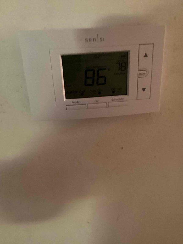 Responded to no cooling call on 10+ year old residential air conditioning system. Upon arrival, found thermostat displaying 86°F but unit not responding to cooling demand. Performed diagnostic evaluation of outdoor condensing unit and discovered significant corrosion and debris accumulation in electrical control panel affecting system operation. Inspected all electrical connections, contactor, and control wiring. Identified failed components preventing compressor and condenser fan from engaging. Cleaned electrical panel, replaced defective contactor and capacitor, verified proper voltage at all connection points, and restored system to full operational status. Unit cycling properly with normal amperage draw. Advised customer of system age and condition for future maintenance planning.