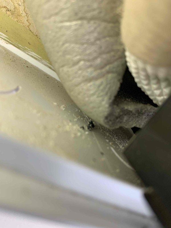 Responded to service call for leaking 5-month-old Mitsubishi mini split system under first-year warranty. Inspected indoor and outdoor units, located source of water leak at condensate drainage system. Cleared blocked condensate drain line, verified proper drainage flow, and confirmed unit operation with no further leakage detected upon completion.