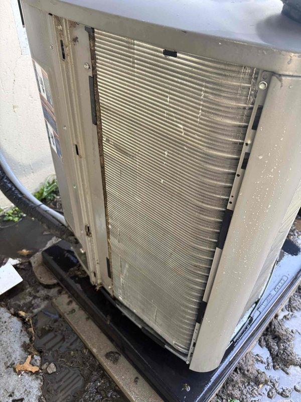Responded to no-cool service call for ground-mounted outdoor condenser unit at Home Depot location. Upon arrival, confirmed customer complaint that fan was not engaging and system was not providing cooling. Performed diagnostic inspection of unit, removed service panel to access internal components, and assessed condenser coil condition which showed moderate accumulation of dirt and debris on aluminum fins. Completed necessary repairs to restore fan operation and cooling function, ensured unit was operating properly before departure per customer's special instructions to leave fan running with AC turned off.