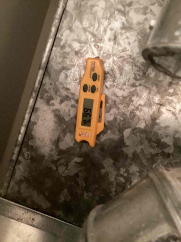 Responded to no cooling complaint on second floor unit. Upon inspection, discovered extensive ice buildup on evaporator coil, with surface temperature reading 38°F on measurement device. Identified restricted airflow as primary cause due to inadequate attic insulation coverage and distribution around air handler. Thawed frozen coil, verified proper refrigerant charge, and confirmed system operation restored. Recommended improved insulation installation to prevent future airflow restriction and maintain proper system performance.