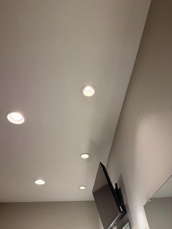 Responded to service call for non-functioning three-way light switch in master bathroom. Diagnosed electrical issue with three-gang switch configuration controlling recessed ceiling lighting fixtures. Troubleshot wiring connections, identified faulty switch mechanism, and restored proper operation to the three-way switching system controlling five recessed can lights installed in the angled ceiling.