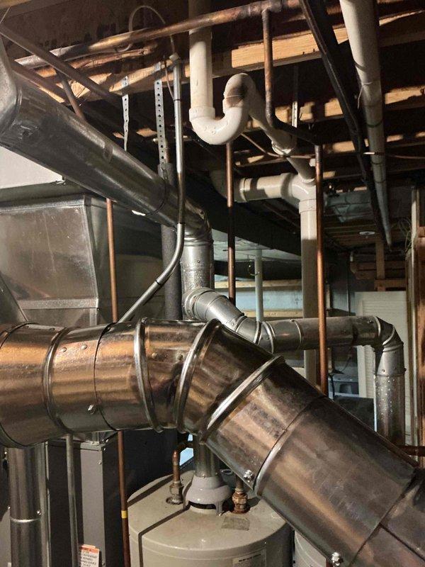 Responded to service call for no pilot light on one of two tanked water heaters in basement. Upon inspection, determined existing unit was beyond economical repair. Installed new 75-gallon gas tall water heater as replacement. Connected gas supply line, installed new temperature and pressure relief valve with discharge piping to code, and established proper venting through existing ductwork system. Integrated unit into existing plumbing infrastructure with appropriate shut-off valves and unions for future serviceability. Tested all connections for leaks, verified proper combustion and venting, and confirmed adequate hot water delivery to fixtures throughout home. Unit operational and performing to manufacturer specifications upon completion.