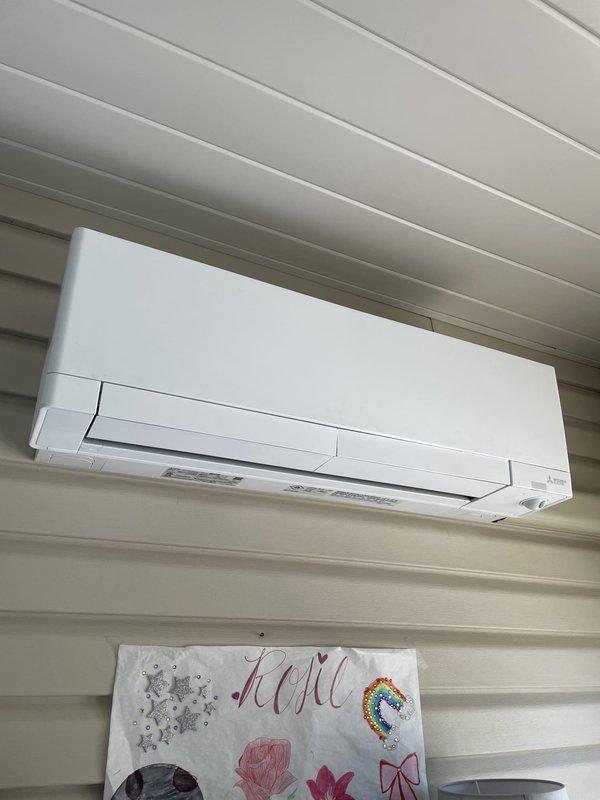 Responded to no cooling complaint on 1-year-old ductless mini-split system located in sunroom. Upon inspection, found indoor wall-mounted air handler and outdoor condensing unit both operational but system not achieving desired temperature. Verified refrigerant charge, cleaned outdoor coil fins which showed minor debris accumulation, and confirmed proper airflow from indoor unit. System restored to normal cooling operation and tested successfully before departure.
