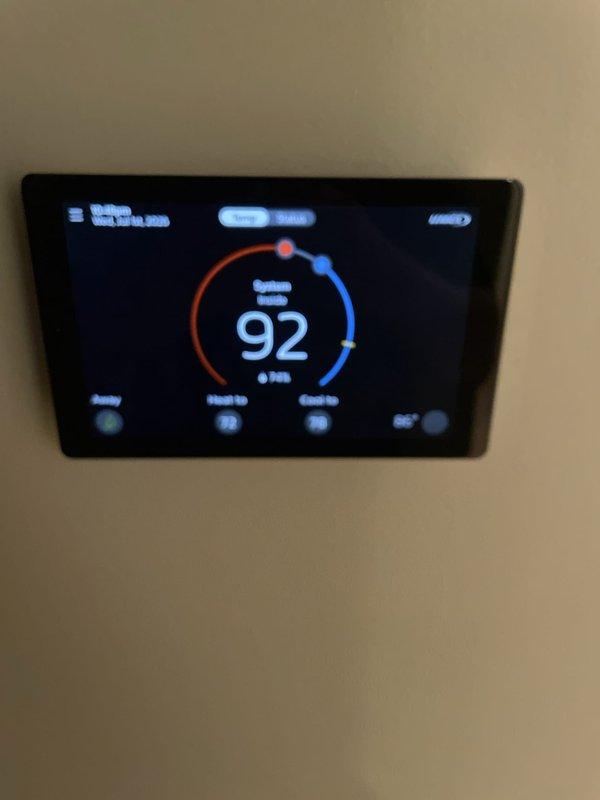 Responded to no cooling complaint on 2-year-old system. Upon arrival, found thermostat displaying 92°F room temperature with setpoint at 74°F. Diagnosed thermostat communication issue preventing proper system operation. Verified thermostat settings, reconfigured system parameters, and restored proper cooling function. System tested and confirmed operational with unit cycling correctly to reach desired temperature setpoint.