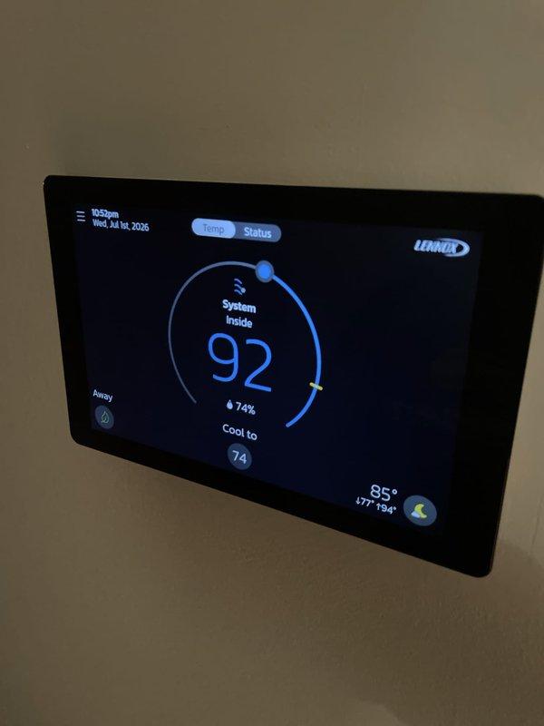 Responded to no cooling complaint on 2-year-old system. Upon arrival, found thermostat displaying 92°F room temperature with setpoint at 74°F. Diagnosed thermostat communication issue preventing proper system operation. Verified thermostat settings, reconfigured system parameters, and restored proper cooling function. System tested and confirmed operational with unit cycling correctly to reach desired temperature setpoint.