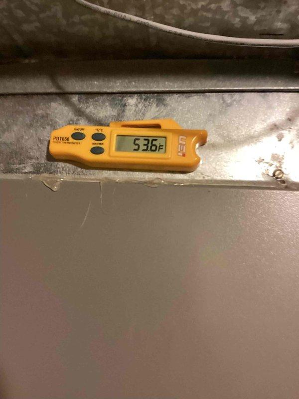Responded to service call for zoned heating system malfunction where both upstairs and downstairs units were calling but only the downstairs system was operating. Inspected dual-zone HVAC system with control board and thermostat wiring at unit located at rear of property. Diagnosed zone control board issue preventing proper communication between thermostats and upstairs air handler. Verified supply air temperature reading of 53.6°F at equipment. Tested zone damper operation and control signals to isolate communication failure in upstairs zone circuit. Restored proper heating operation to both zones by addressing control board wiring connections and verifying thermostat call signals were reaching both air handling units.