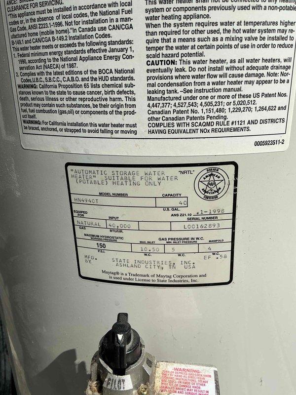 Installed a 50-gallon tall A.O. Smith natural gas water heater (Model HNA74Q1) with blue expansion tank and copper piping connections in residential utility closet. Additionally repaired two leaking interior hose bibs on a time and materials basis. Installation completed without permit as specified for Jefferson County requirements.