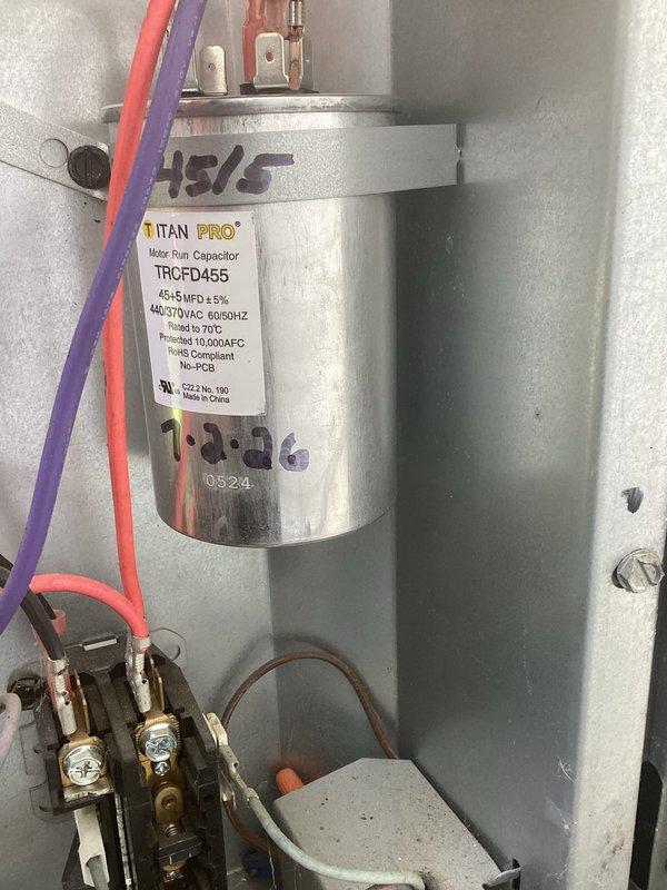 Replaced defective evaporator coil in Goodman air handler (S/N 1605231362). Installed new coil assembly, verified proper refrigerant connections, and tested system operation. Replaced dual-run capacitor (TITAN PRO TRCFD455, 45/5 MFD) during repair to ensure reliable system performance. Unit tested successfully in both heating and cooling modes with normal operation confirmed. Retained old coil for warranty purposes.