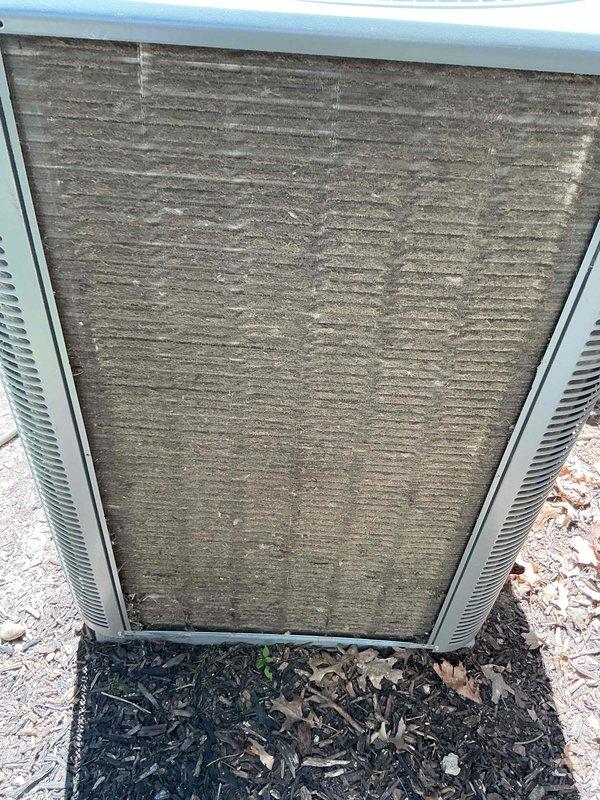 Completed preventive maintenance tune-up on two residential cooling units: one ground-level exterior unit and one basement unit, both approximately one year old. Performed comprehensive inspection including checking refrigerant levels, electrical connections, and capacitor operation on both systems. Replaced air filter on basement unit, which was found to be relatively clean. Cleaned heavily soiled condenser coil on exterior ground unit, removing significant accumulation of dirt, dust, and debris that had built up on the intake surfaces. Verified proper airflow, tested thermostat operation, and confirmed both units are cycling correctly and operating within manufacturer specifications. All components functioning properly with no immediate service needs identified.