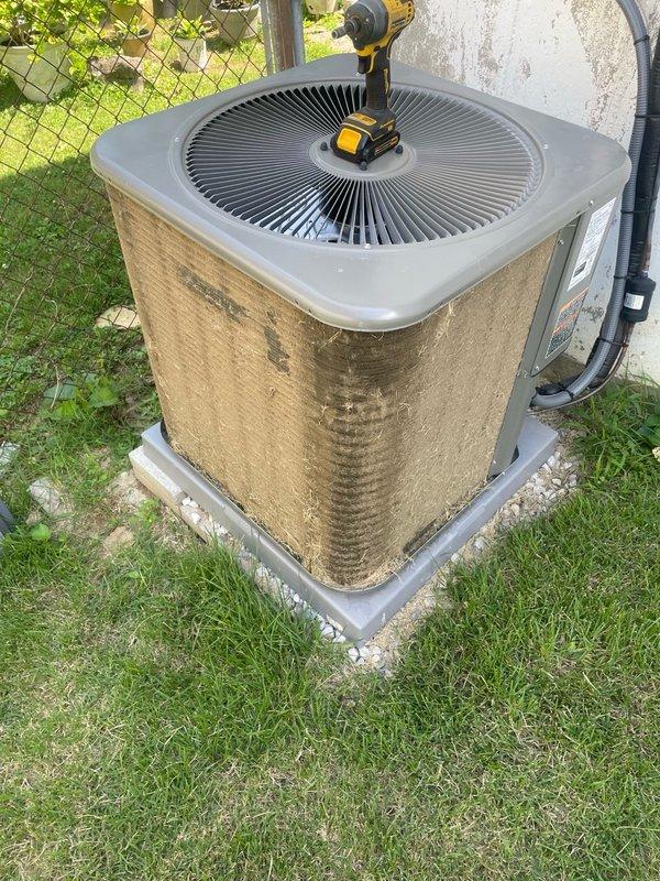 Responded to no-cool complaint on recently installed system where thermostat would not cool below 80 degrees. Upon arrival, performed diagnostic inspection of outdoor condenser unit and found heavily soiled air filter restricting airflow to the system. Cleaned and serviced the condenser unit, addressing the clogged filter that was preventing proper heat exchange and limiting cooling capacity. System tested and confirmed operational, now cooling properly below 80 degrees as designed.