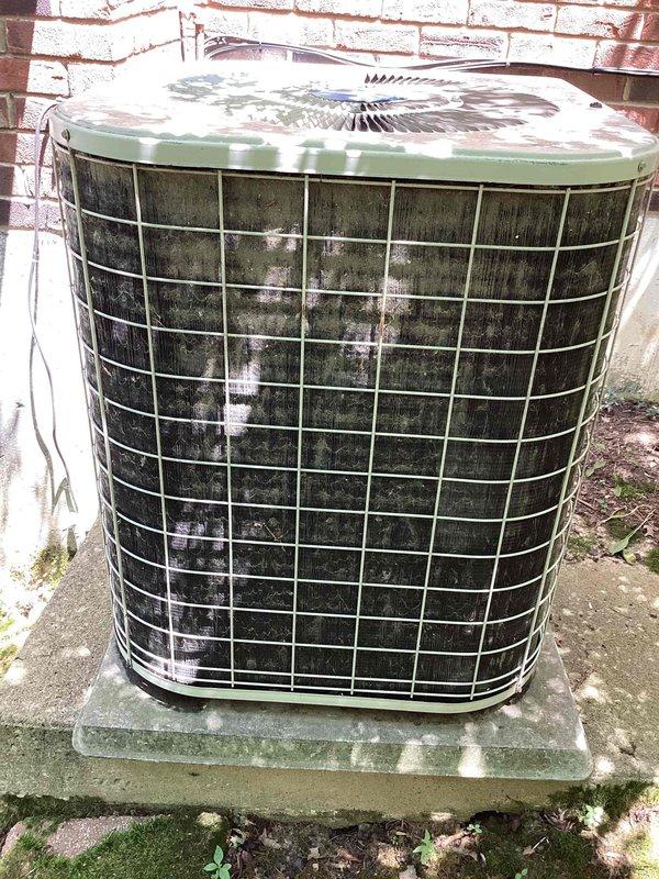 Responded to no cooling complaint on 10+ year old outdoor condenser unit located on side of home. Upon arrival, found unit operational but exhibiting significant age-related deterioration with heavy exterior soiling, algae growth on pad, and visible weathering throughout. Thermostat confirmed system running in cooling mode at 79°F setpoint with fan in auto position. Performed diagnostic evaluation of aging equipment to determine cooling deficiency and assessed whether repair or replacement would be most appropriate solution. Documented unit condition with photographs showing extensive environmental wear and discussed findings with customer regarding recommended course of action for restoring proper cooling performance.