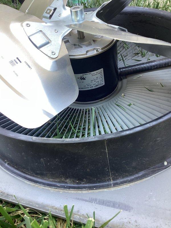 Replaced failed condenser fan motor (CFM) and damaged fan blade on outdoor HVAC unit. Removed old motor and blade assembly, installed new components sourced from supplier, and verified proper operation. Disposed of defective parts per standard procedure.