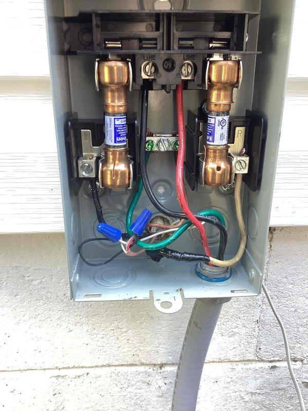 Replaced faulty electrical disconnect box on HVAC system exterior unit after electrical service was completed. Removed old disconnect containing damaged fuses and wiring, installed new disconnect with proper cartridge fuses and reconnected all electrical connections per manufacturer specifications.