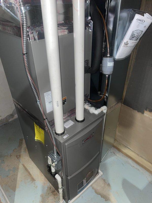 Responded to no cooling complaint on Unit 10, a Lennox system located at ground level on side of home. Upon arrival, measured supply air temperature at floor register reading 83.5°F, confirming lack of cooling. Advised customer to shut AC off immediately and leave fan running to prevent further system damage. Documented system configuration including furnace, ductwork connections, and overall installation condition with photographic evidence for further diagnostic evaluation.