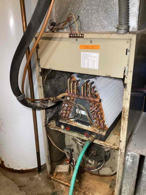 Responded to no cooling complaint on unit 10 located in backyard. Upon inspection, found evaporator coil heavily contaminated with dirt and debris accumulation, significantly restricting airflow. Blower motor assembly exhibited substantial dust buildup on blower wheel and housing. Observed corrosion and dark deposits on copper coil surfaces affecting heat transfer efficiency. System was shut down prior to arrival due to lack of cooling performance caused by restricted airflow through dirty evaporator coil and compromised blower assembly operation.