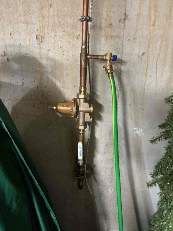 Installed a 50-gallon tall gas water heater with 3/4" pressure relief valve in residential basement utility area. Completed copper piping connections with brass fittings to main water supply lines, installed expansion tank mounted to ceiling joists with secure strapping, and verified all connections for proper operation. Material was ordered through Ferguson supply house under purchase order #1332285-001, and installation was performed in compliance with St. Charles County permit requirements.