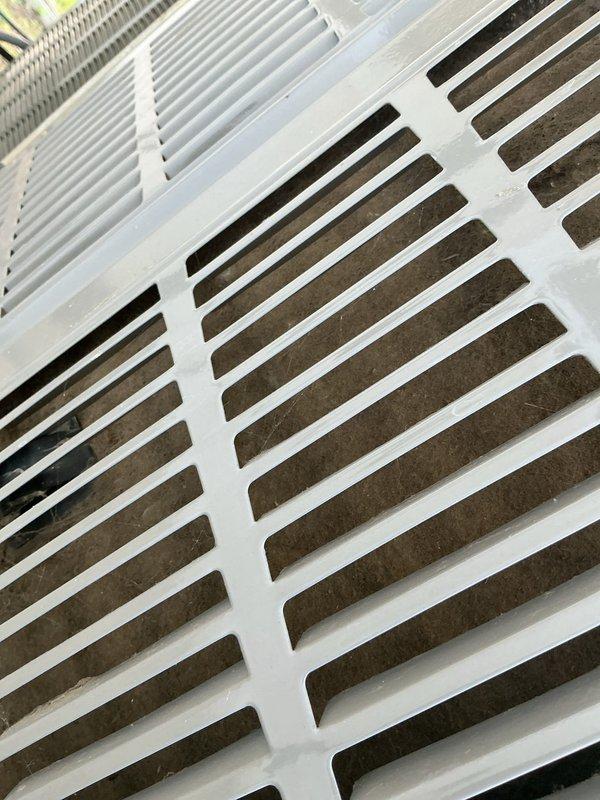 Responded to no cooling complaint on 10+ year old residential air conditioning system located at side of home. Upon arrival, performed visual inspection of outdoor condenser unit and discovered significant dirt and debris accumulation on condenser coil fins, restricting proper airflow and heat transfer. Cleaned condenser coil, removed obstructions from grille openings, and verified system operation. Unit restored to proper cooling function with improved airflow through heat exchanger. Recommended regular maintenance to prevent future efficiency loss.