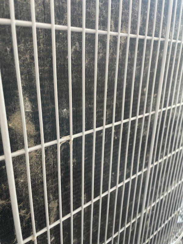 Responded to no cooling complaint on single outdoor condensing unit. Upon arrival, found condenser coil heavily loaded with dust and debris accumulation, restricting airflow through heat exchanger fins. Cleaned condenser coil thoroughly to restore proper heat transfer capability. Verified unit operation with adequate airflow and proper cooling cycle restored. System returned to normal operating condition.