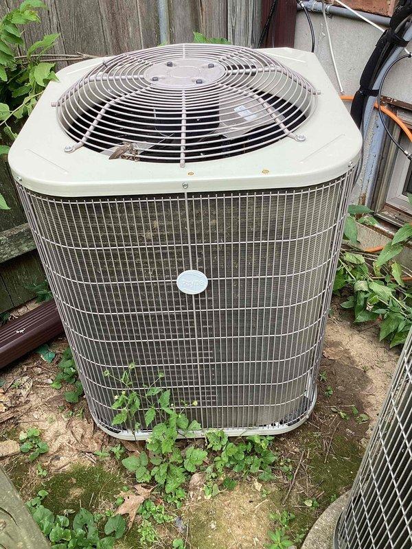 Responded to no cooling complaint with frozen evaporator coil. Upon arrival, confirmed thermostat set to OFF position with room temperature reading 79°F. Inspected outdoor condensing unit and found unit operational but experiencing reduced airflow condition leading to coil freeze-up. Documented system condition with photos of thermostat display and outdoor unit placement. Issue differs from previously scheduled estimate appointment. Recommended allowing coil to thaw completely before further diagnostics to determine root cause of freezing condition, which may include low refrigerant charge, restricted airflow from dirty filter or blocked return, or blower motor malfunction.