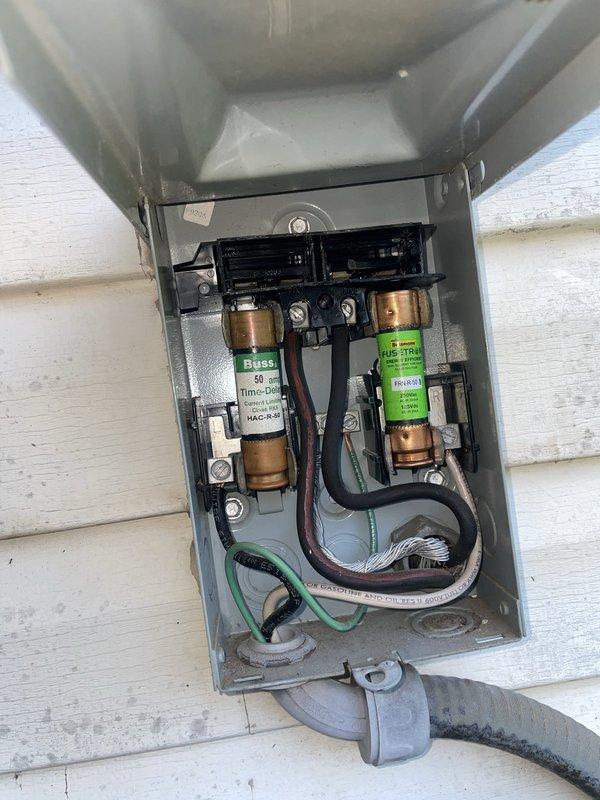 Responded to no cooling call on 15-year-old residential AC unit. Upon arrival, found system not operating due to blown fuses in exterior disconnect box. Replaced both 50-amp FLNR time-delay fuses and restored power to unit. Verified thermostat calling for cooling and system responding properly with unit cycling on and achieving target temperature of 72°F. System tested and left operational.