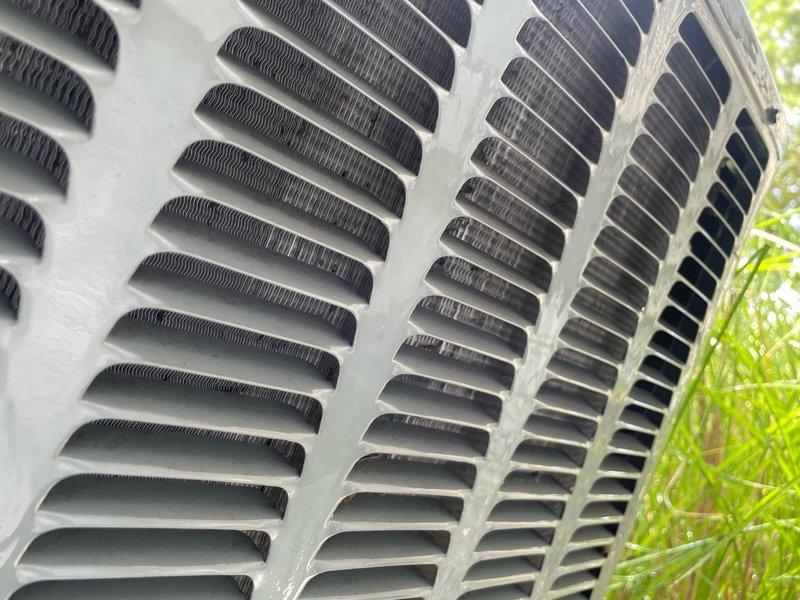 # HVAC Service Report - No Cool Call

Responded to no cooling complaint on 13-year-old residential air conditioning system. Upon arrival, performed complete system diagnostic including visual inspection of outdoor condenser unit, electrical component testing, and refrigerant pressure analysis. Condenser unit exterior showed normal weathering consistent with age, with louvers and grilles intact but displaying accumulated debris and dust buildup from outdoor exposure.

Identified failed compressor as root cause of complete system failure. Compressor tested with no electrical continuity and showed no attempt to start during diagnostic procedures. Verified proper voltage supply to unit, confirmed contactor operation, and ruled out capacitor failure through testing. Run capacitor tested within acceptable range, and all safety controls functioning properly.

Due to age of system and cost-effectiveness analysis, recommended full system replacement rather than compressor replacement on 13-year