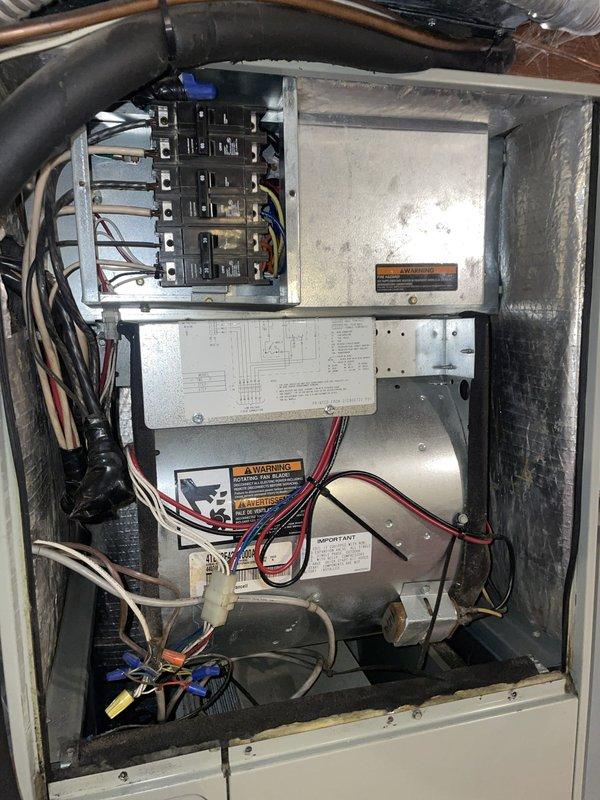 Completed comprehensive cooling system tune-up on residential AC unit located at side of home. Performed refrigerant pressure analysis using manifold gauge set, verifying proper system charge and operating pressures across both high and low sides. Inspected condenser coil fins, which were found to be clean and in good condition. Examined electrical components, circuit breakers, and wiring connections within the air handler cabinet, confirming all connections were secure and system controls were functioning properly.
