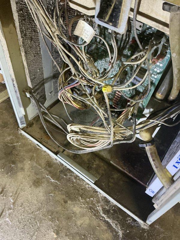 Responded to no cooling complaint affecting entire residence with 18-year-old Trane system. Upon arrival, performed comprehensive diagnostic evaluation of both indoor and outdoor equipment. Inspected indoor furnace/air handler unit and accessed control board compartment to examine electrical connections and circuit boards. Documented system age and overall condition through visual inspection of equipment, noting multiple control boards, wiring harnesses, and internal components. Photographed furnace installation showing PVC venting configuration and ductwork connections, as well as internal electrical components including dual green circuit boards and wire routing. Given the advanced age of the system (17-20 years old) and no cooling condition, provided customer with assessment findings and recommended next steps for system evaluation and repair options to restore cooling function to the home.