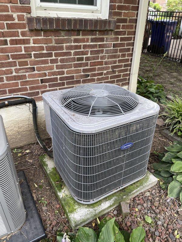 Responded to no cool air complaint on Unit 10. Upon arrival, inspected Lennox furnace system in basement and Carrier outdoor condenser unit. Condenser showed signs of weathering with visible dirt accumulation and algae growth on concrete pad indicating drainage concerns. Performed diagnostic evaluation of refrigerant lines, electrical connections, and compressor operation. Verified thermostat communication and airflow through indoor air handler. System operational at time of departure with cooling restored.