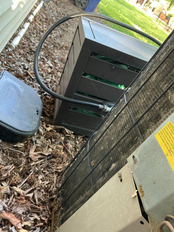 Completed comprehensive cooling system tune-up on 31-year-old ground-level AC unit. Performed full system inspection including condenser coil cleaning, electrical connection evaluation, capacitor testing, and refrigerant line assessment. Unit showing significant age-related weathering and corrosion on exterior panels and internal components, but all systems operational following maintenance service.