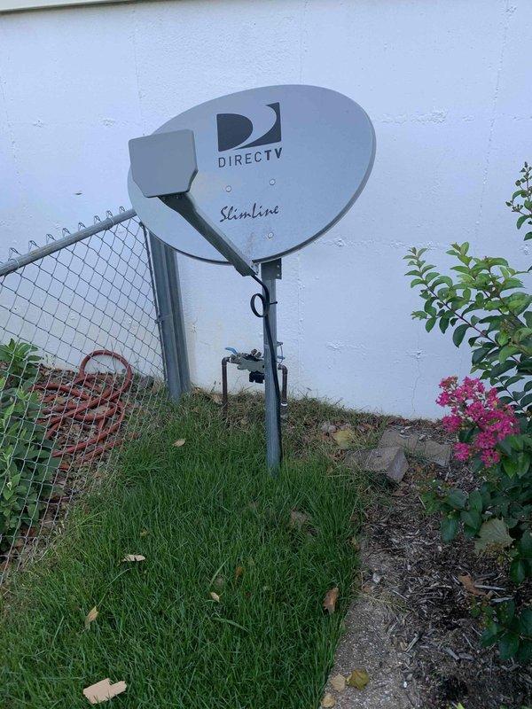 Conducted comprehensive site assessment for whole home generator installation. Evaluated existing electrical infrastructure and identified optimal placement location along exterior wall with adequate clearance from utilities and structures. Documented current electrical service configuration and available space for generator pad installation. Assessed fuel source options and utility connections including gas line accessibility. Photographed installation site showing proposed generator location near chain-link fence boundary with clear access pathway. Evaluated ground conditions and verified sufficient clearance from satellite equipment and other exterior fixtures. Documented site measurements and clearance requirements for code compliance. Provided detailed estimate for complete generator system installation including transfer switch, electrical connections, and necessary permits.
