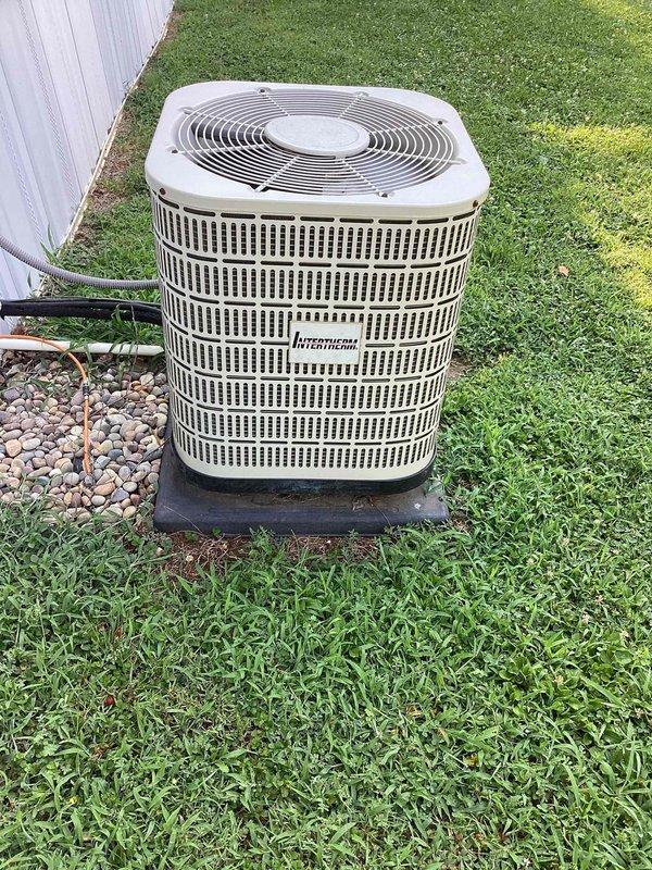 Performed comprehensive air conditioning tune-up on 17-year-old Intertherm condensing unit located at side of residence. Inspected heat exchanger assembly, verified refrigerant line connections, checked electrical components and wiring, cleaned condenser coils, and confirmed proper operation of all system components. Unit found in serviceable condition with adequate airflow and no major deficiencies noted at time of service.