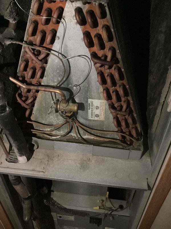 Performed comprehensive air conditioning tune-up on 17-year-old Intertherm condensing unit located at side of residence. Inspected heat exchanger assembly, verified refrigerant line connections, checked electrical components and wiring, cleaned condenser coils, and confirmed proper operation of all system components. Unit found in serviceable condition with adequate airflow and no major deficiencies noted at time of service.