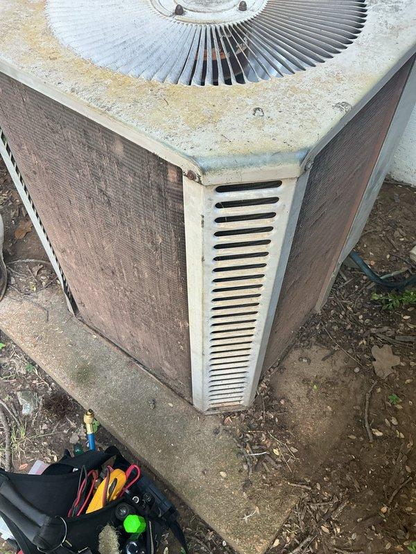 Responded to no cooling call on 20-year-old residential air conditioning system. Upon arrival, confirmed outdoor condenser unit was not operating and indoor system had no airflow. Performed diagnostic evaluation of both outdoor condensing unit and indoor air handler. Inspected electrical connections, tested capacitor values, and checked refrigerant pressures. Evaluated compressor functionality and verified thermostat communication. Due to age of equipment and extent of failure, discussed system condition and repair versus replacement options with homeowner. Unit showed significant weathering and wear consistent with two decades of operation. Documented equipment condition with photos for customer records.