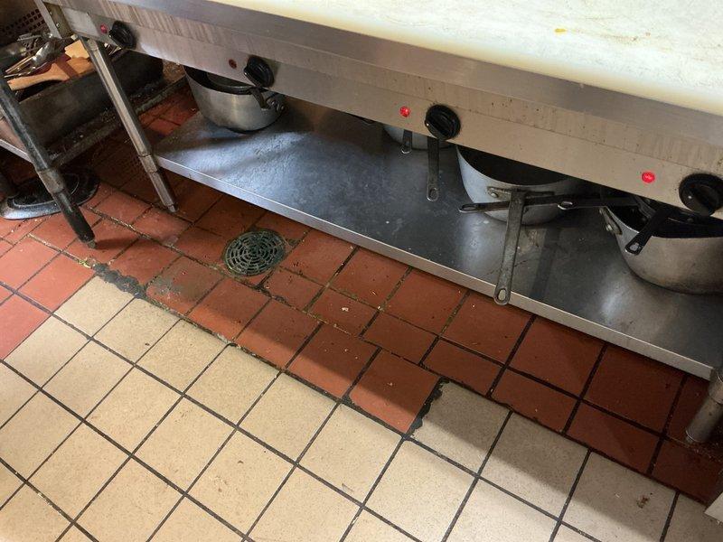 Responded to commercial kitchen clogged drain call during business hours. Upon arrival, located floor drain in kitchen prep area beneath stainless steel equipment. Cleared obstruction from drain line using appropriate plumbing tools, restoring proper drainage flow. Tested drain functionality and confirmed complete clearance with no backup or slow drainage issues remaining.