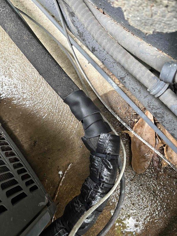 Responded to service call to reinsulate refrigerant lines on outdoor AC compressor unit in preparation for occupancy inspection. Removed deteriorated insulation from suction and liquid lines running from exterior condensing unit, cleaned copper piping, and installed new foam pipe insulation with proper sealing and weatherproofing. Secured all insulation joints, verified proper drainage line function, and confirmed system met code requirements for inspection approval.